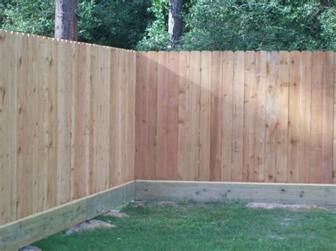 The Use Of A Rot Board Along The Bottom Of A Standard Wood Privacy