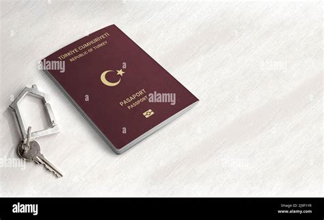 Turkish Passport Citizenship By Real Estate Investment Passport And Home Key On A Wood Table