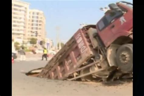 Watch Heavy Truck Creates Sinkhole In Road