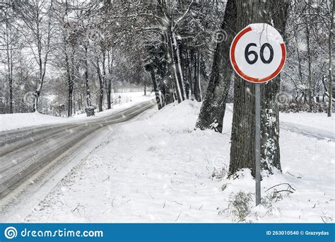 Km H Speed Limit Road Sign In Snowy Road Stock Photo Image Of