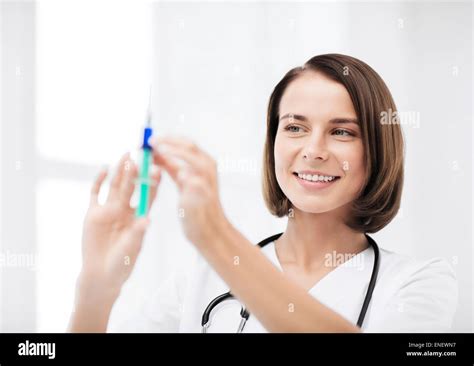 Female Doctor Holding Syringe With Injection Stock Photo Alamy