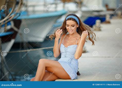 A Very Beautiful Sensual And Girl In A Blue Striped Dress I Stock Image