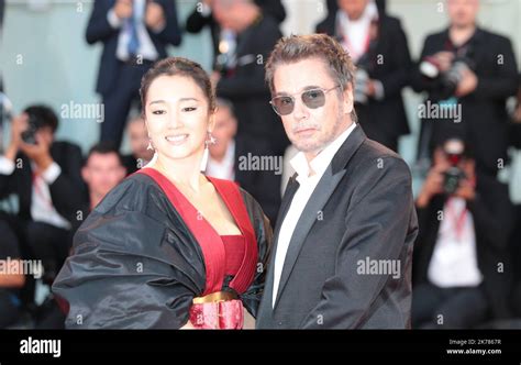 Gong Li and Jean-Michel Jarre arriving for the premiere of Saturday ...