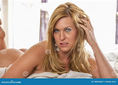 Gorgeous Blonde Model Poses Nude In A Home Environment Stock Image