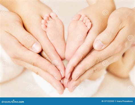 Newborn Baby Feet Parents Holding In Hands Stock Photo Image Of Arms