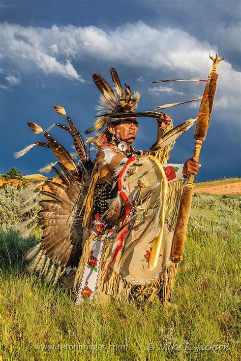 Shoshone Native American In A Traditional Sneak Up Dance Against A Stormy Wyoming Sky Phot