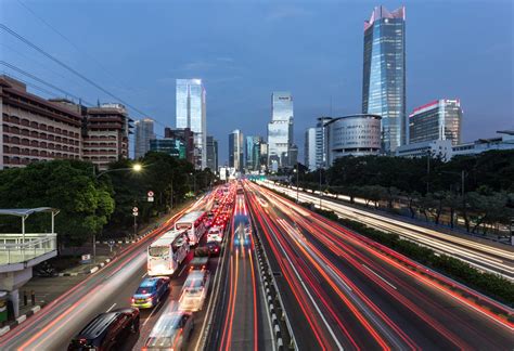 Traffic light trail in Jakarta business district highway at night in ...