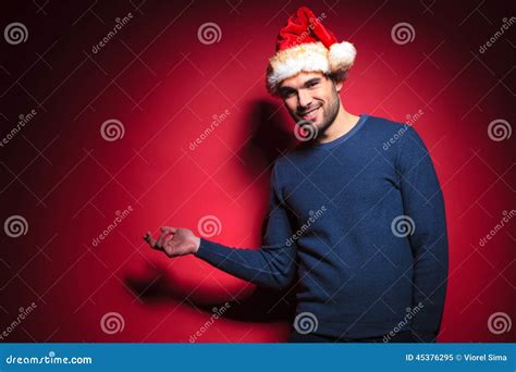 Santa Man Is Presenting A Blank Board Stock Photo Cartoondealer