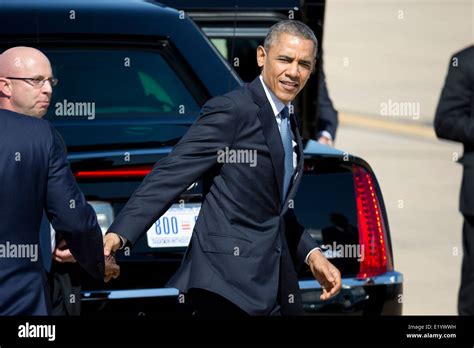 Pres. Barack Obama shakes hands with former trade representative Ron Kirk (far left) as he ...