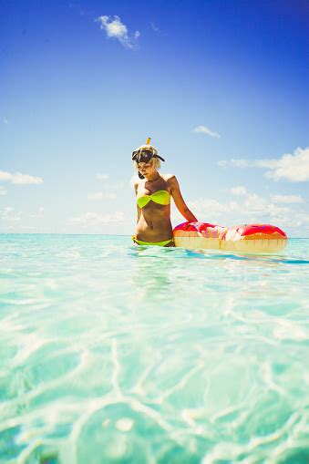 Blonde Woman Standing In Shallow Water With Snorkel Equipment Maldives