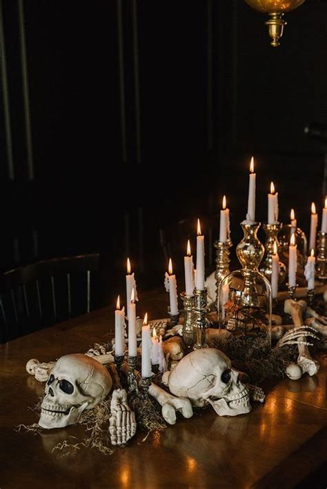 Gorgeous Halloween Table Styling With Moss Skulls Bones And Lots Of Candles In Metallic