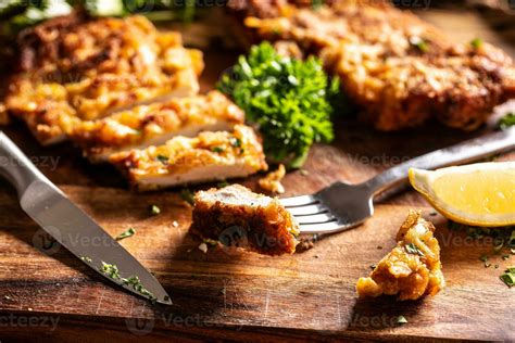 Viennese Chicken Steak On A Fork Traditional Austrian And German Dish
