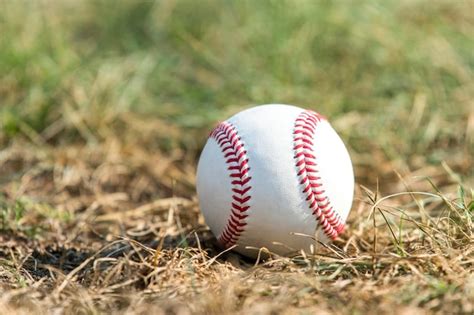 Premium Photo Close Up Of Baseball On Grassy Field