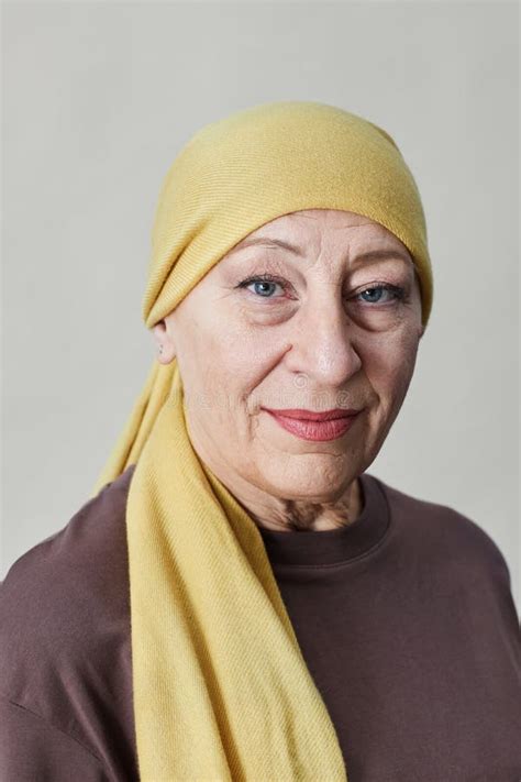 Smiling Adult Woman Wearing Headscarf And Looking At Camera Stock Image