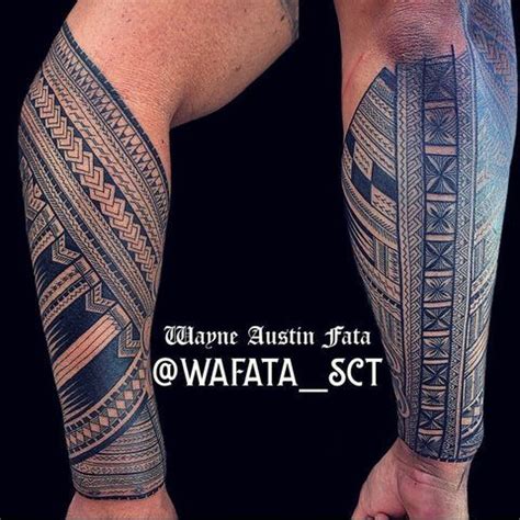 A Man S Arm And Leg Covered In Tattoos With The Words Wafata On It