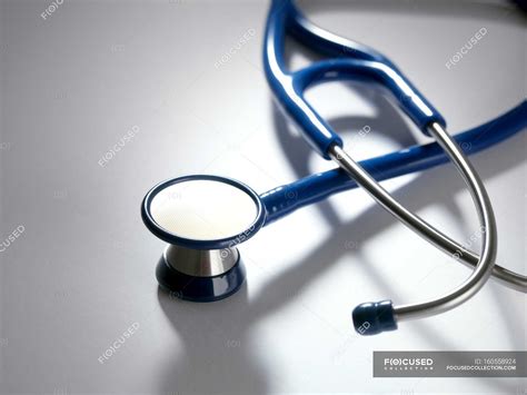 Close-up of blue stethoscope on white background. — general practice ...