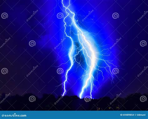 Lightning Strike On The Dark Cloudy Sky Stock Photo Image Of Energy