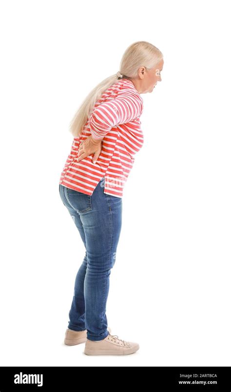 Mature Woman Suffering From Back Pain On White Background Stock Photo