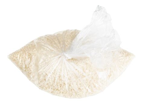Premium Photo Raw White Rice In Knotted Plastic Bag Isolated