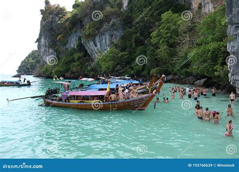 Tourist Having A Longtail Boat Tour From Phi Phi To Maya Bay With Snorkeling And Swimming