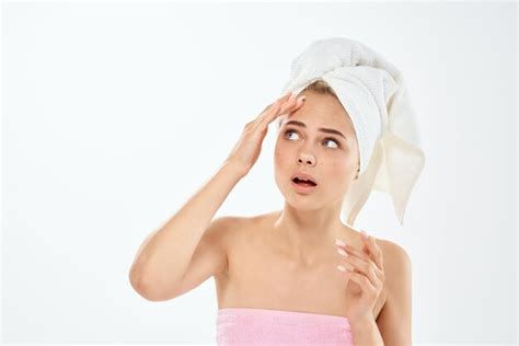 Premium Photo Woman With Bare Shoulders With A Towel On Her Head