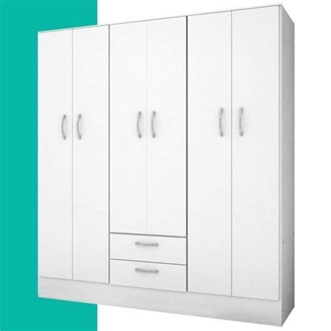 A White Cabinet With Three Doors And Two Drawers In Front Of A Teal Wall