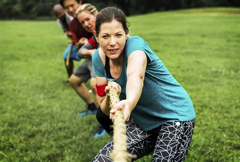 Team competing in tug of war | Photo - rawpixel