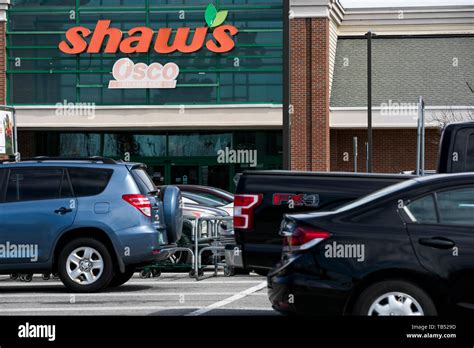 A Logo Sign Outside Of A Shaws Supermarkets Retail Grocery Store