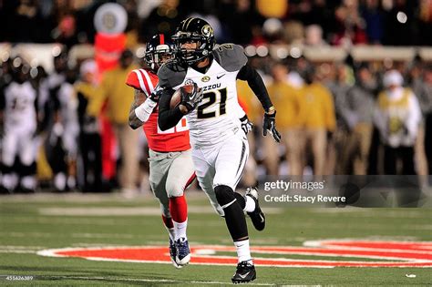 Bud Sasser Of The Missouri Tigers Runs For Yards Against The Ole Miss