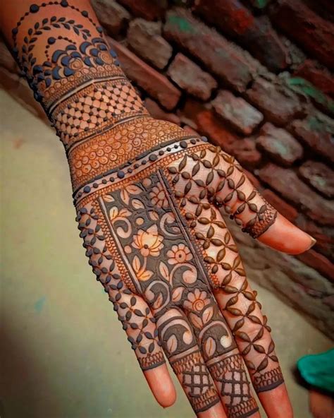 The Hand Is Decorated With Intricate Designs