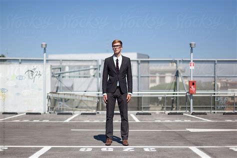 Man Standing In A Empty Car Park By Mattia Pelizzari Man Standing