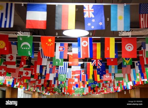 Many Countries Flags Hanging From A Ceiling On Ropes Stock Photo Alamy