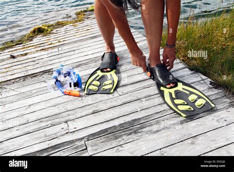 Woman wearing diving flippers Stock Photo - Alamy