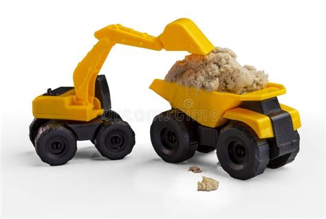 Toy Excavator Loads the Dump Truck with Sand. Stock Image - Image of ...