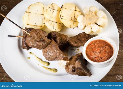 Anticuchos Peruvian Cuisine Grilled Skewered Beef Heart Meat With Boiled Potato And White Corn