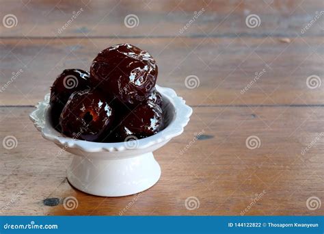 Sweet Jujube Or Chinese Red Date In Syrup In White Thai Style Cup On