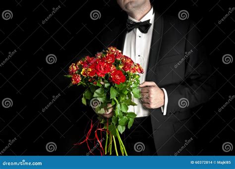 Elegant Man In Tuxedo Holding Red Roses Stock Photo Image Of Lover