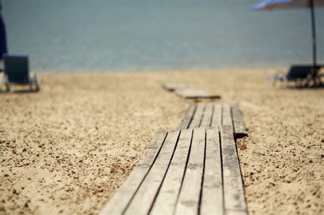 Premium Photo | Wooden walkway on the beach