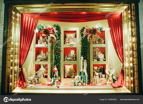 Decorating A Toy Shop Window During The Christmas Holidays Stock