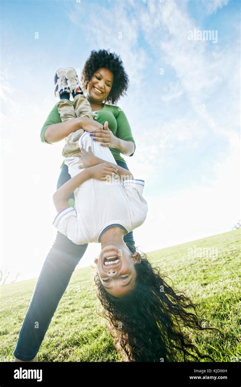 Mother Holding Daughter Upside Down Hi Res Stock Photography And Images