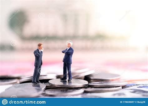 Two Businessmam Standing On The Coin And Banknote US Dollar Singapore