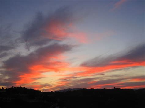 The Sky Is Pink And Blue With Some Clouds