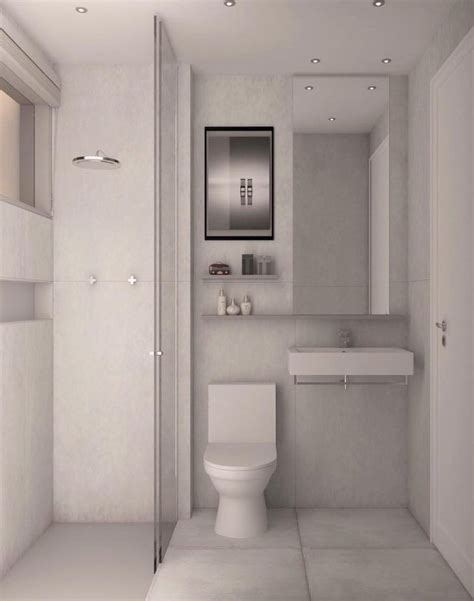 A Bathroom With A Toilet Sink And Mirror In It S Center Wall Area