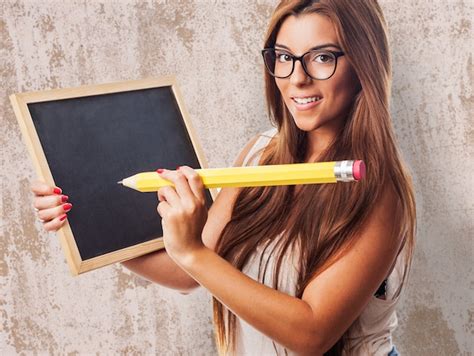 Free Photo Woman With A Blackboard And A Big Pencil