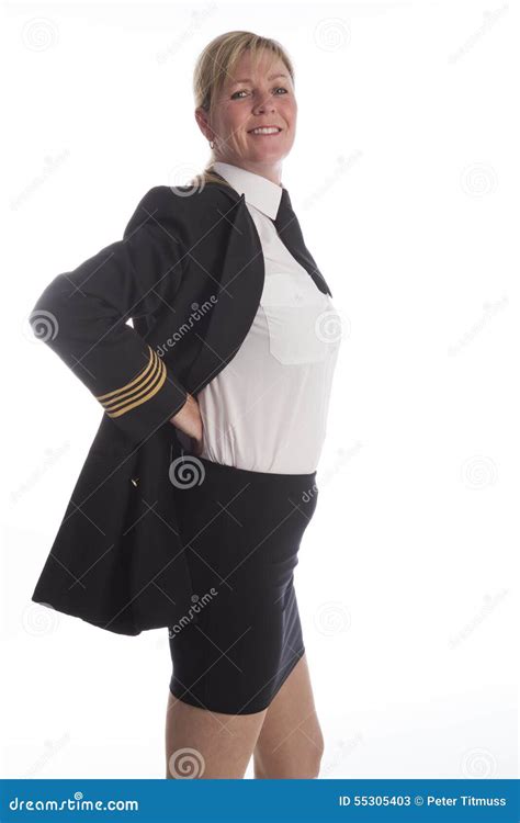 Airline Pilot Standing Adjusting Her Uniform Stock Photo