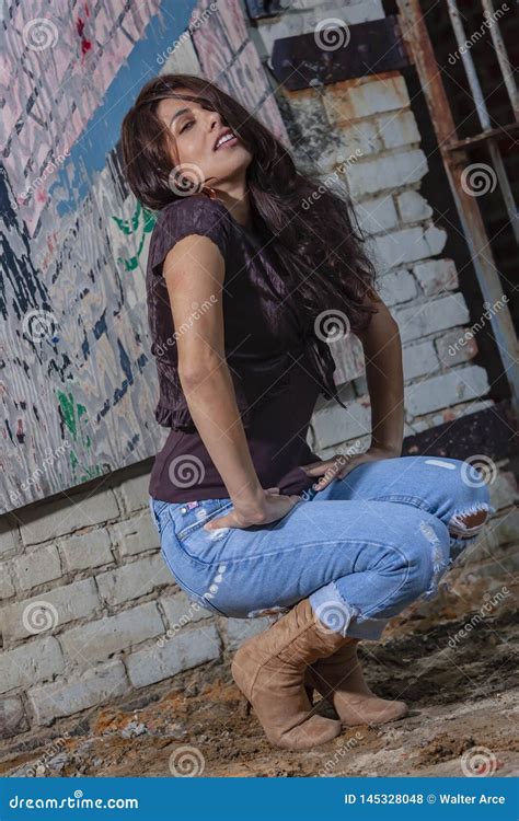 A Lovely Brunette Model Posing Outdoors With The Latest Fashions Stock Photo Image Of Female