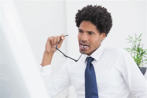 Premium Photo Thoughtful Businessman Holding His Glasses