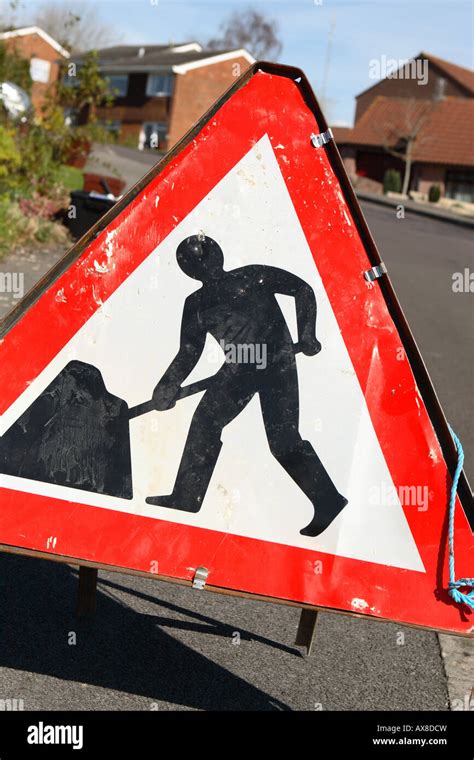 Man digging road work sign hi-res stock photography and images - Alamy