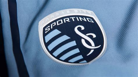 Download Sporting Kansas City Logo On Jersey Wallpaper | Wallpapers.com