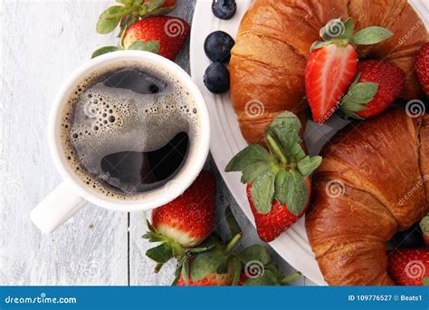 Coffee And Croissant And Fruits With Coffee Beans Breakfast Ene Stock